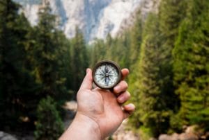 Person Holding Old GPS