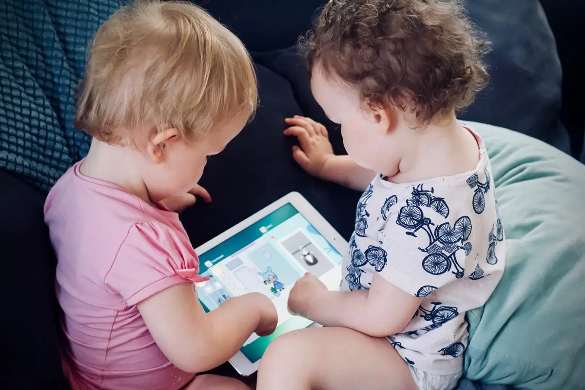 two baby using tablet