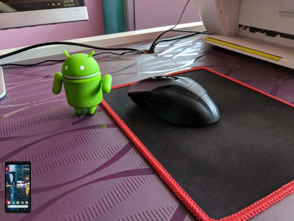 Android Toy Near Computer Mouse