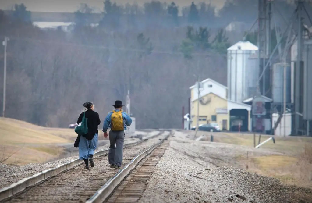 Two person walking in track