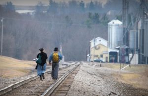 Two person walking in track