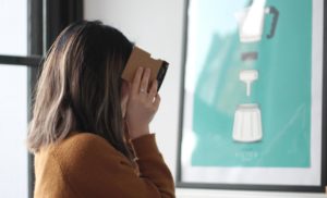 Woman using Google Cardboard VR