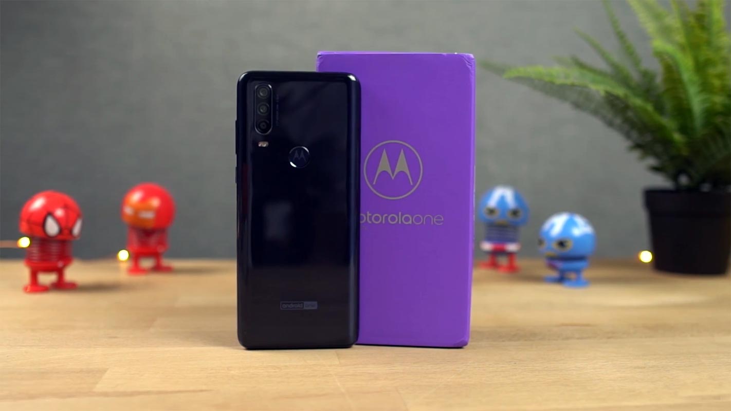 Motorola One Action on the Wooden table with Retail Box