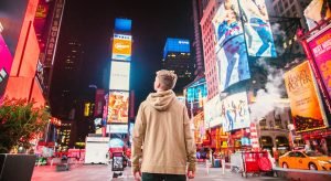 Person Looking Digital Banner Ads in Street