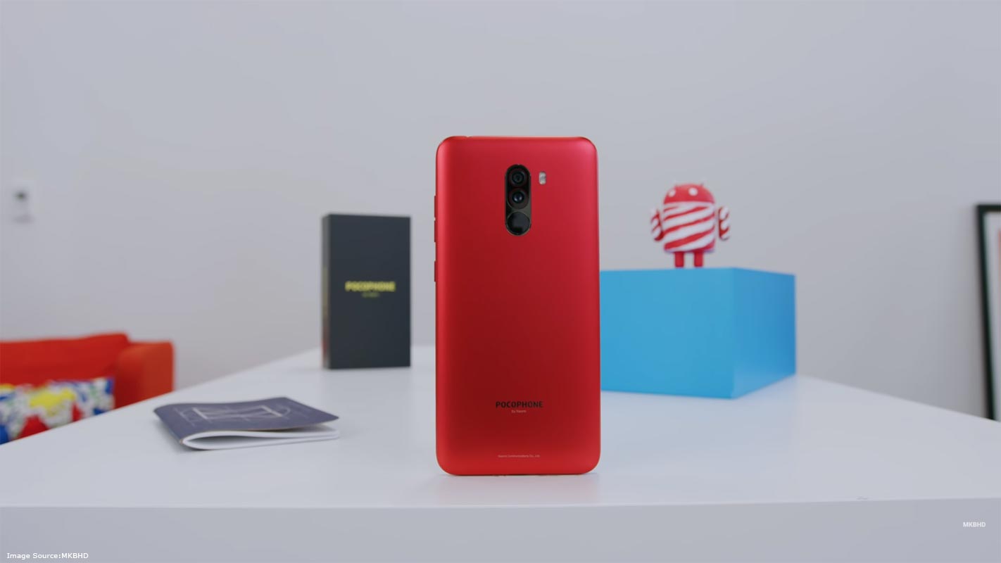 Pocophone F1 REd on the Table With Retail Box in the Background