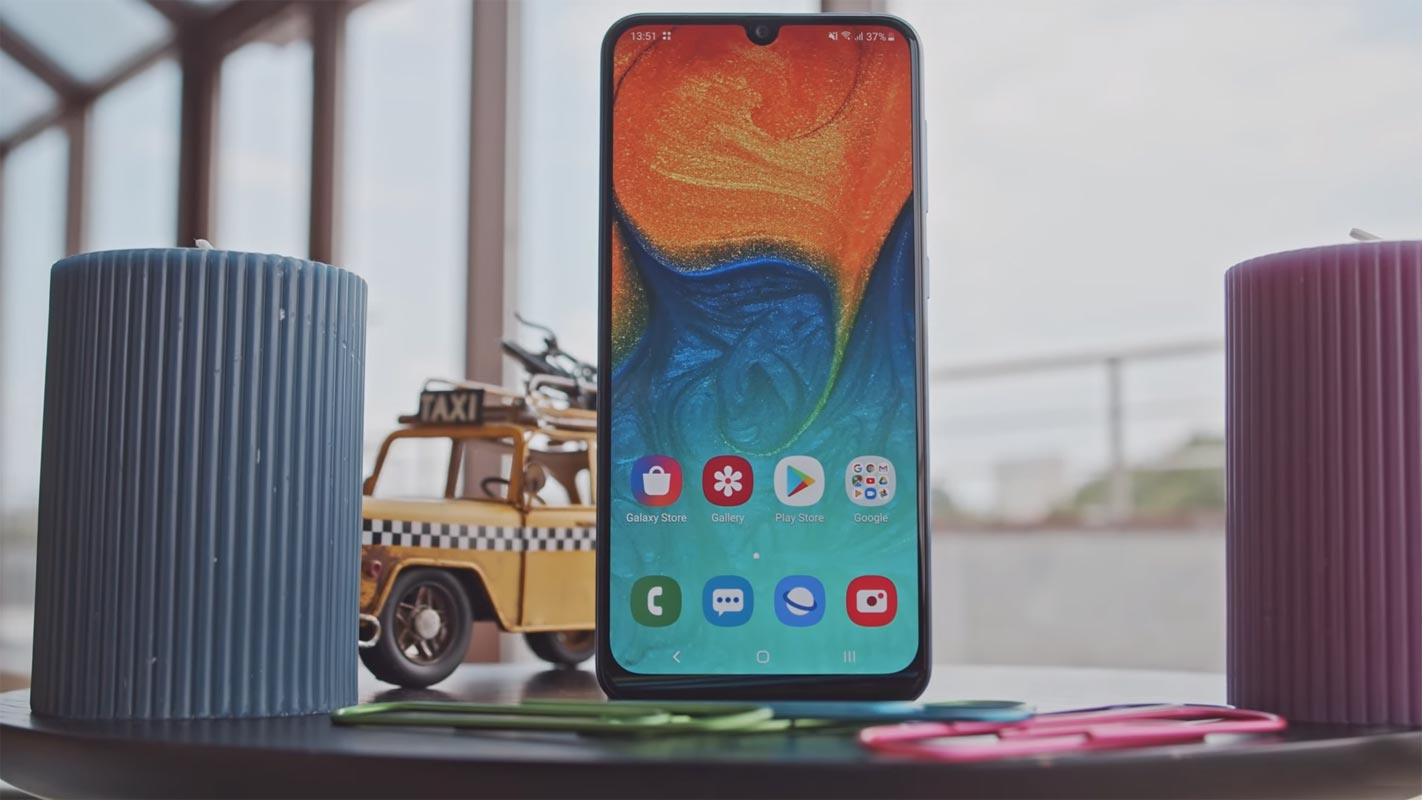 Samsung Galaxy A30 on the Table with Plastic Toys