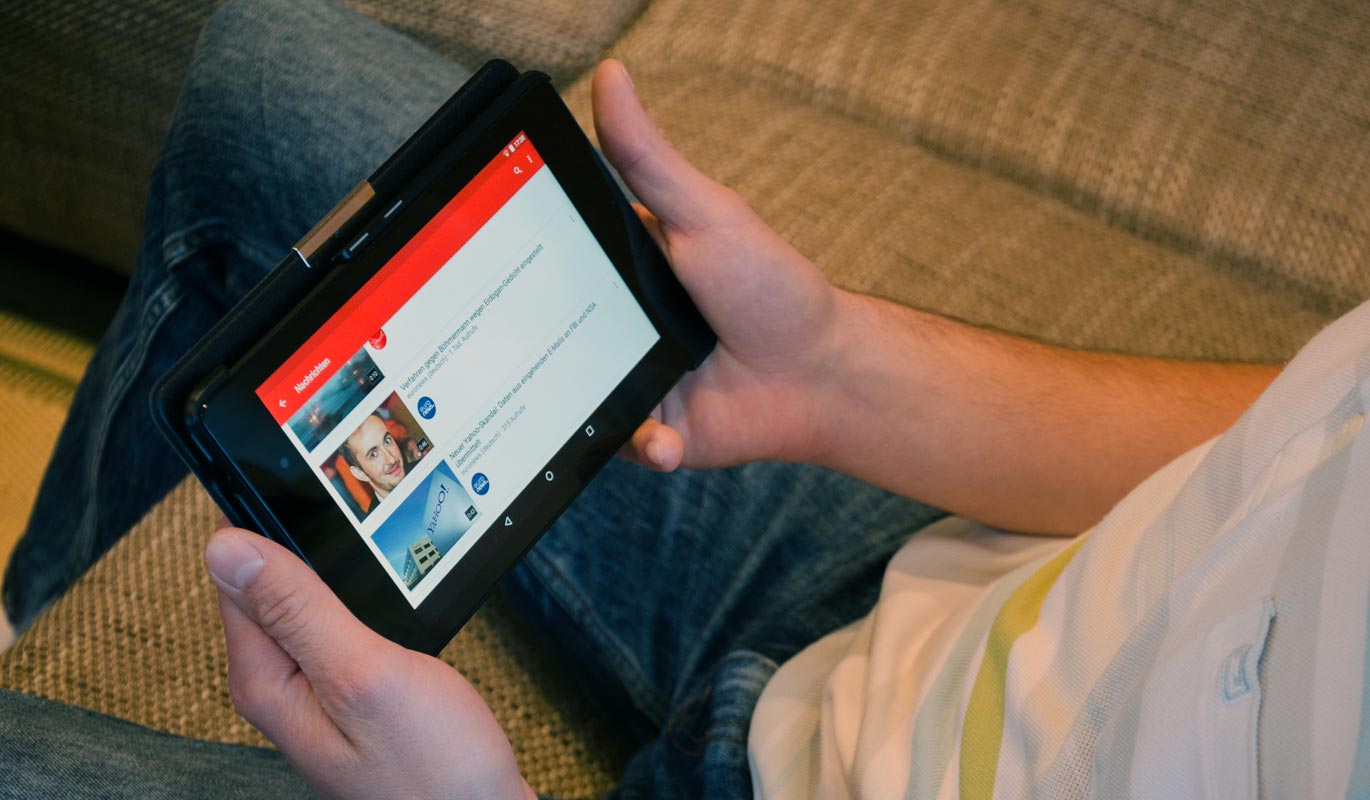 Person Watching YouTube in Tablet