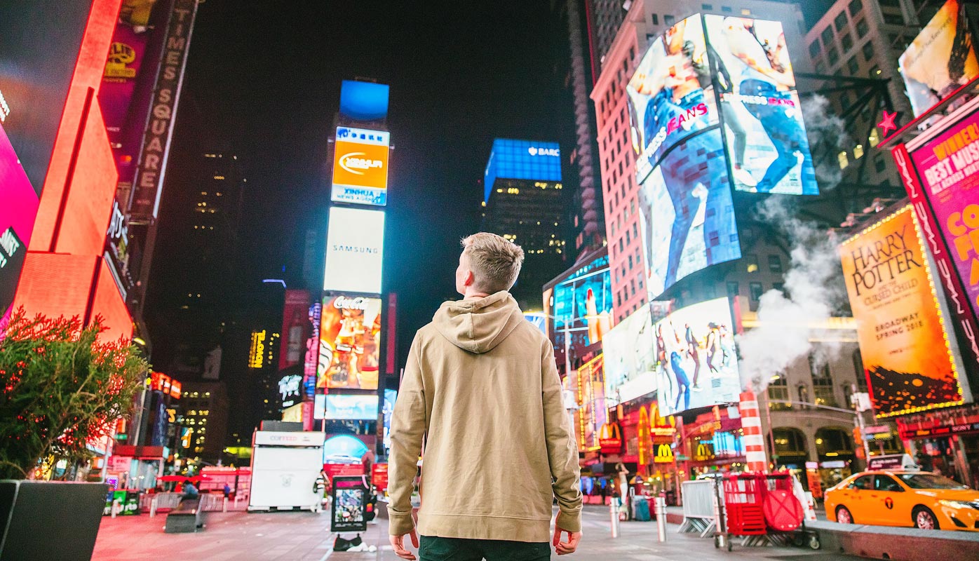 Man Seeing Ads in Street Banners