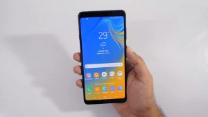 Samsung Galaxy A9 2018 Home Screen in the hand