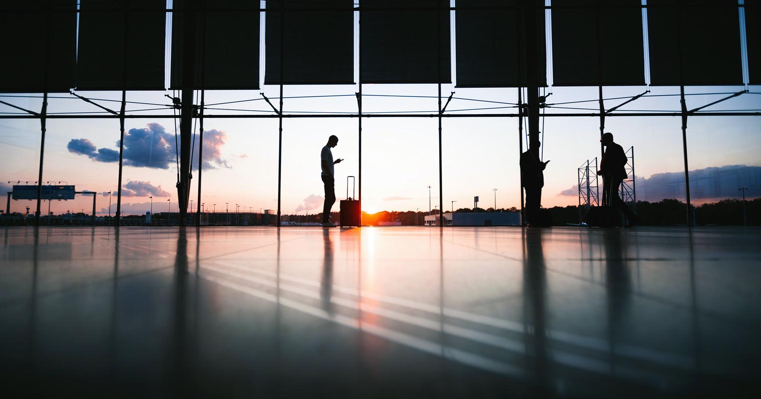 People using mobile in Airport