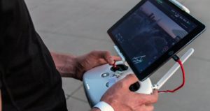 Man Controlling Drone using Joystick