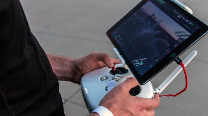Man Controlling Drone using Joystick