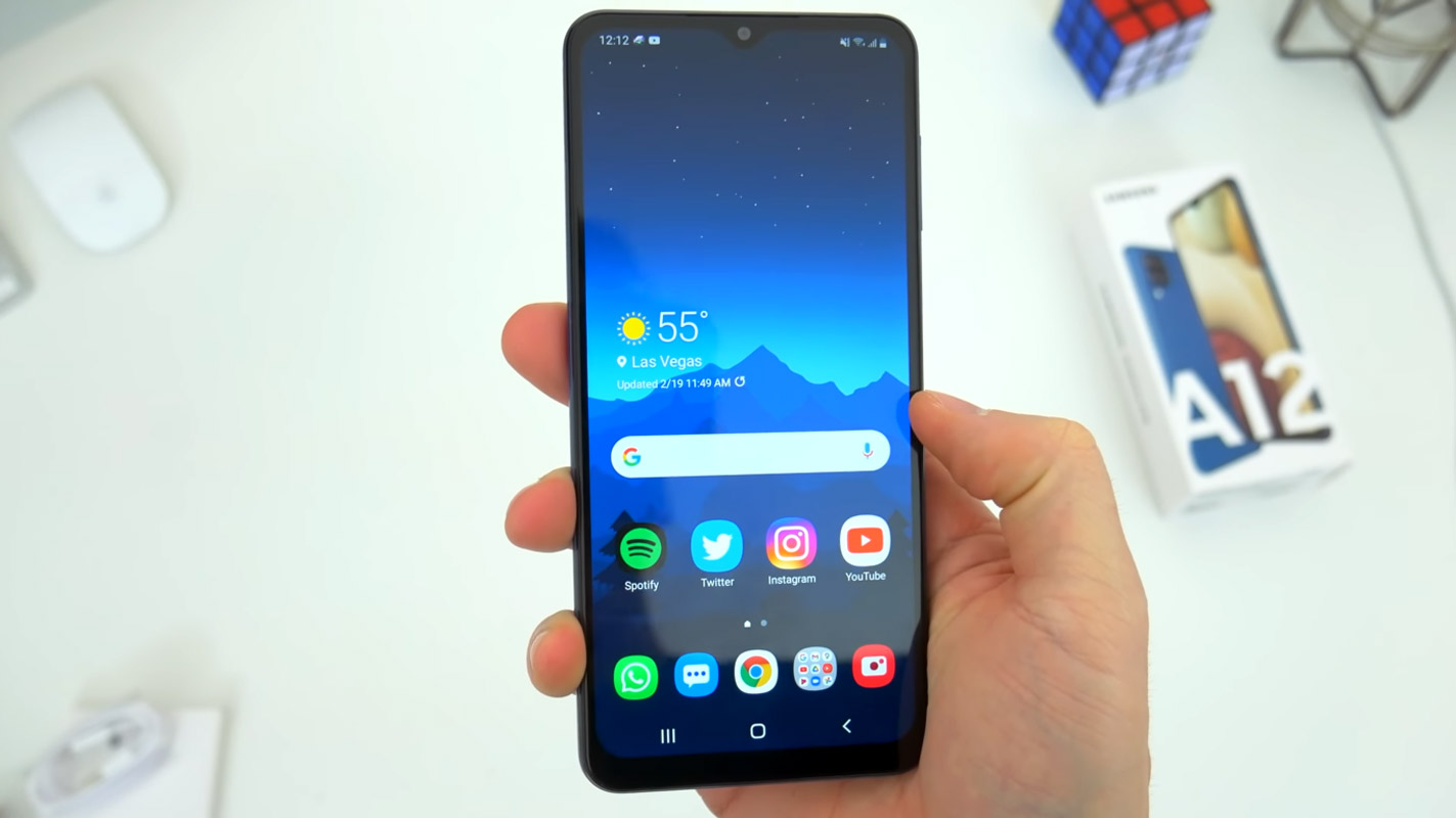 samsung galaxy a12 home screen in hand